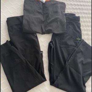 Black scrubs. Top and two pairs of pants. One pair are joggers
